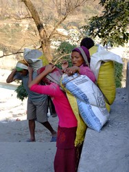 Nepalese Mother and Daughter carrying sand
